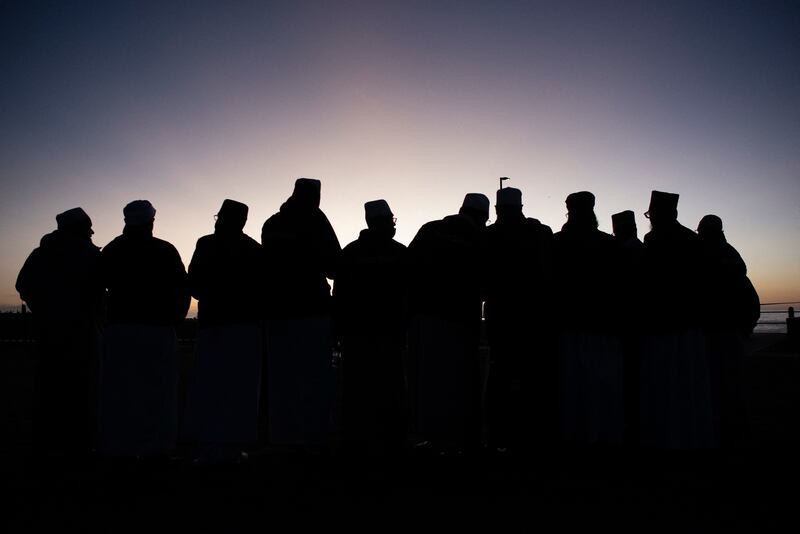 Muslim clerics try to sight the new moon, which will mark the end of Ramadan, In Cape Town, South Africa, May 1, 2022. AFP