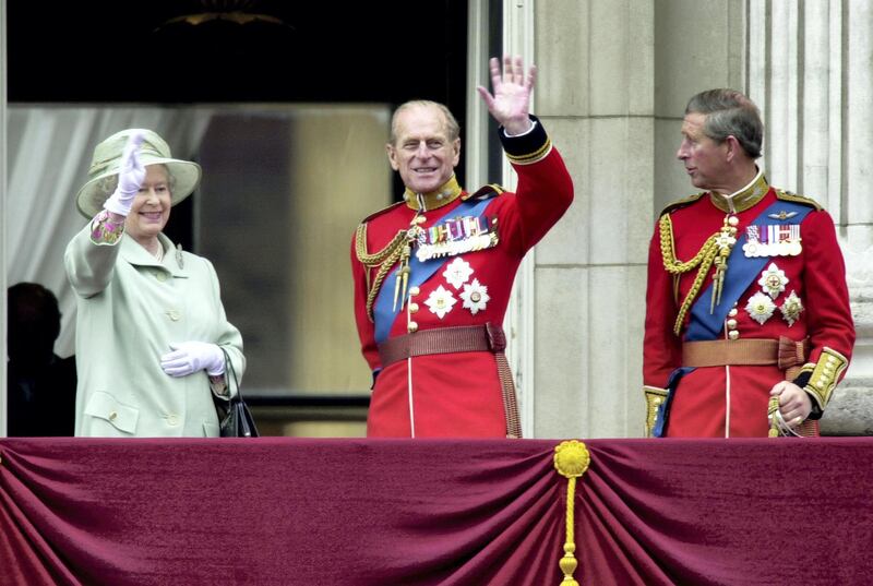 390669 16: Left to right, Britain''s Queen Elizabeth, Prince Philip and Prince Charles wave from the balcony of Buckingham Palace during the "Trooping of the Colour" June 16, 2001 in London. The event is part of the Queen''s birthday celebrations. (Photo by Anthony Harvey/Getty Images)