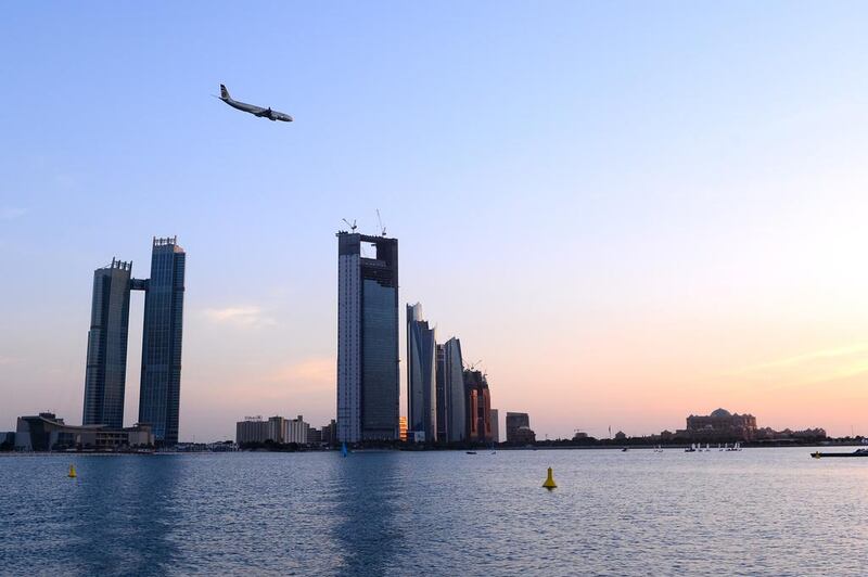 Etihad aircraft flying over the Abu Dhabi corniche in Abu Dhabi. Courtesy Etihad Airways