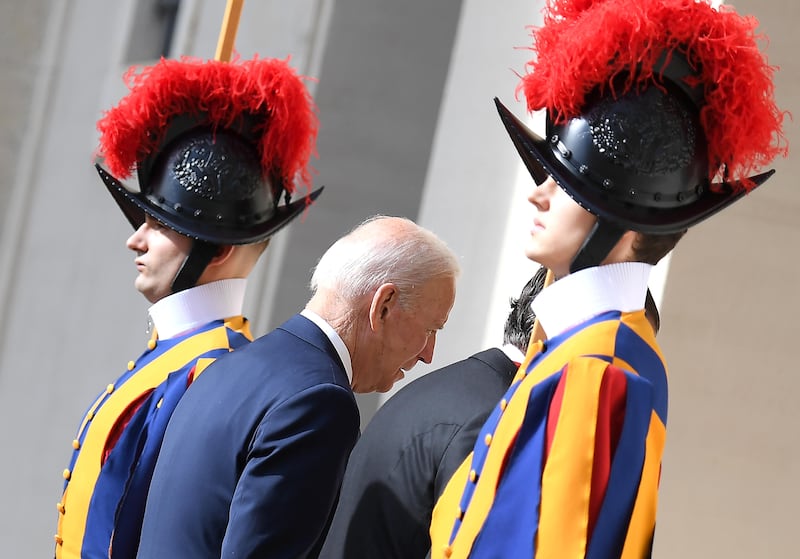 The US president walks past Swiss Guards as he arrives for a private audience with Pope Francis at the San Damaso courtyard in Vatican City on October 29. EPA
