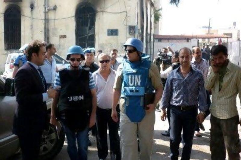 A team of United Nations observers tour the Syrian town of Al Haffe in the Mediterranean province of Latakia with an official Syrian security escort, a day after Syrian authorities said the area had been "cleansed" of rebel fighters. The UN monitors found it all but deserted.