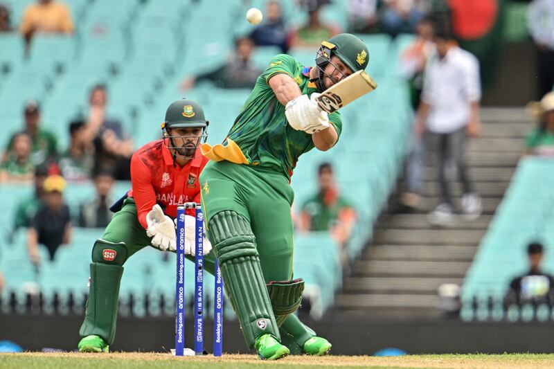  Rilee Rossouw plays a shot in front of Bangladesh's Nurul Hasan. AFP