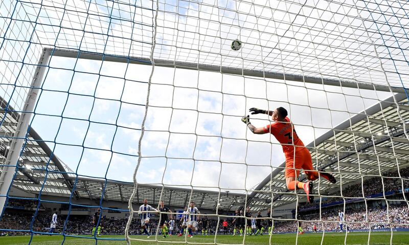 Manchester City's Ederson saves a shot from Brighton's Lewis Dunk. Reuters