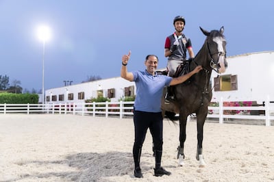 ABU DHABI, UNITED ARAB EMIRATES - OCTOBER 21, 2018. 

Omar Al Marzooqi with his father, Abdulaziz at Al Bahia's Equestrian Stable.

Omar Al Marzooqi made history as the first Emirati to medal at the Youth Olympic Games after claiming silver in the individual showjumping.

Al Marzooqi, who was onboard La Corina Lala, led five riders into the jump-off after each had completed clear rounds on Friday and Saturday at the Club Hipico Argentino on the outskirts of Buenos Aires.

Omar Al Marzooqi made history as the first Emirati to medal at the Youth Olympic Games after claiming silver in the individual showjumping on Sunday.

Al Marzooqi, is trained by his father, Abdulaziz.


(Photo by Reem Mohammed/The National)

Reporter: Amith
Section:  SPORTS