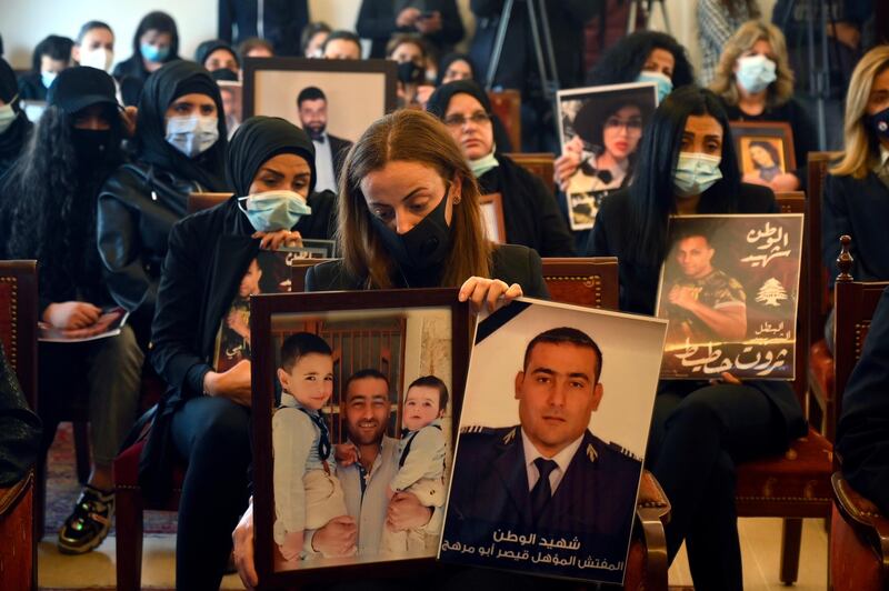 Family members of victims of the Beirut port explosion carry pictures of the victims, during the ceremony on the occasion of Mother's Day in Beirut, Lebanon. EPA