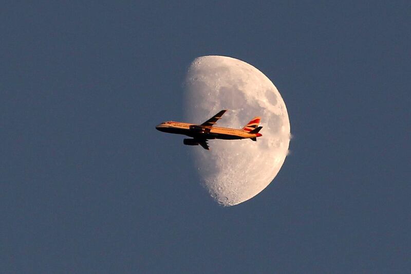 LONDON, ENGLAND - JUNE 28:  A view of a British Airways plane flying past the moon over day four of the Wimbledon Lawn Tennis Championships at the All England Lawn Tennis and Croquet Club on June 28, 2012 in London, England.  (Photo by Dan Kitwood/Getty Images)