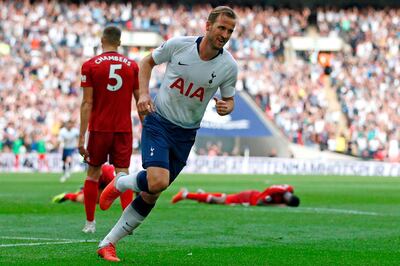 Tottenham Hotspur's English striker Harry Kane celebrates after scoring their third goal during the English Premier League football match between Tottenham Hotspur and Fulham at Wembley Stadium in London, on August 18, 2018. (Photo by Ian KINGTON / AFP) / RESTRICTED TO EDITORIAL USE. No use with unauthorized audio, video, data, fixture lists, club/league logos or 'live' services. Online in-match use limited to 120 images. An additional 40 images may be used in extra time. No video emulation. Social media in-match use limited to 120 images. An additional 40 images may be used in extra time. No use in betting publications, games or single club/league/player publications. / 