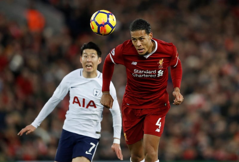 Soccer Football - Premier League - Liverpool vs Tottenham Hotspur - Anfield, Liverpool, Britain - February 4, 2018   Liverpool's Virgil van Dijk in action with Tottenham's Son Heung-min   Action Images via Reuters/Carl Recine    EDITORIAL USE ONLY. No use with unauthorized audio, video, data, fixture lists, club/league logos or "live" services. Online in-match use limited to 75 images, no video emulation. No use in betting, games or single club/league/player publications.  Please contact your account representative for further details.