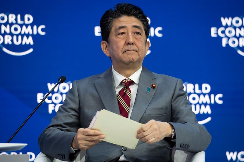 epa07311327 Shinzo Abe, Prime Minister of Japan, speaks during a plenary session in the Congress Hall at the 49th annual meeting of the World Economic Forum (WEF) in Davos, Switzerland, 23 January 2019. The meeting brings together entrepreneurs, scientists, corporate and political leaders in Davos under the topic 'Globalization 4.0' from 22 to 25 January 2019.  EPA/GIAN EHRENZELLER