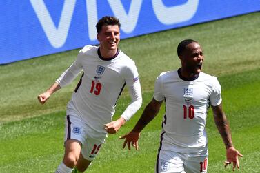 England's Raheem Sterling, right, reacts as he celebrates with teammate Mason Mount after scoring his team's first goal during the Euro 2020 soccer championship group D match between England and Croatia at Wembley stadium in London, Sunday, June 13, 2021. (AP Photo/Justin Tallis, Pool)
