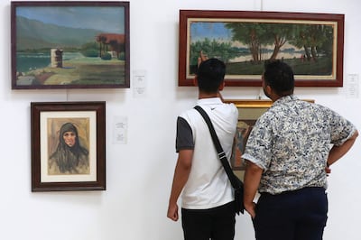 Visitors browse art at the National Museum of Modern Art in Baghdad. AFP