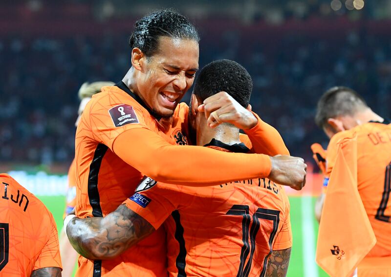 Netherlands' Memphis Depay celebrates scoring their second goal with Virgil van Dijk. Reuters