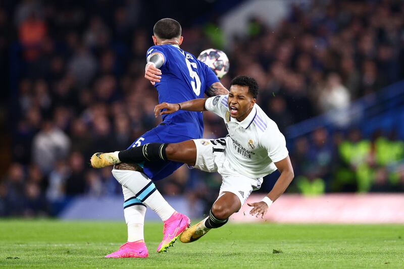Rodrygo of Real Madrid is challenged by Enzo Fernandez of Chelsea. Getty