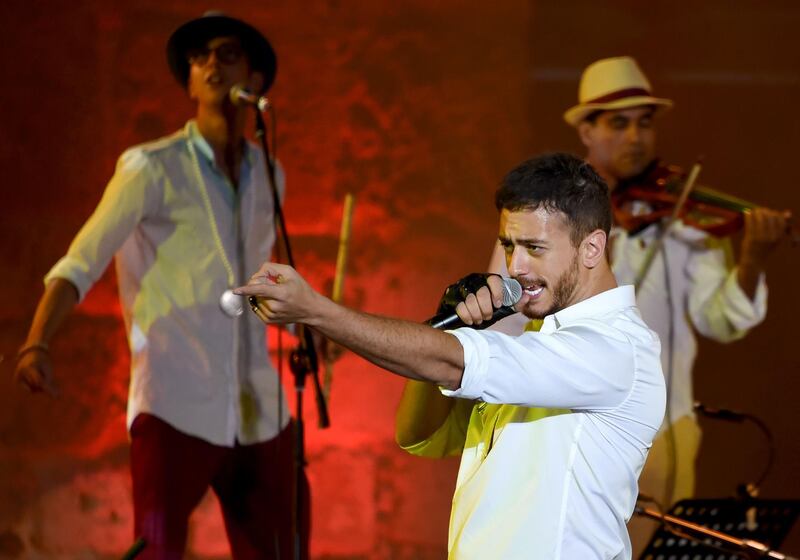 (FILES) In this file photograph taken on July 30,2016, Moroccan singer Saad Lamjarred performs during the 52nd session of the International Carthage Festival at The Roman Theatre of Carthage near Tunis. - Lamjarred has been charged with "rape" on August 28, 2018, by a district judge of the Draguignan courthouse following a complaint by a young woman, according to the prosecutor's office of Draguignan, southeastern France. (Photo by FETHI BELAID / AFP)