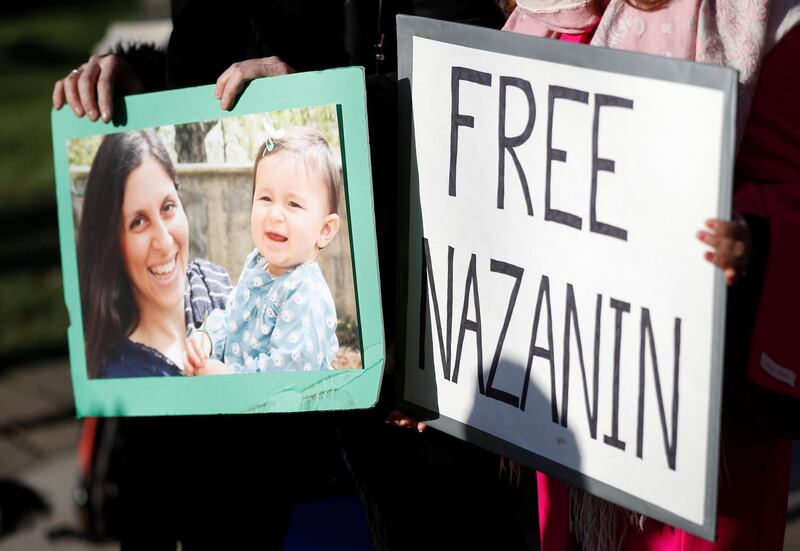Demonstrators hold placards before a march in support of Nazanin Zaghari-Ratcliffe, the British-Iranian mother who is in jail in Iran, in London, Britain, November 25, 2017. REUTERS/Peter Nicholls NO RESALES. NO ARCHIVE