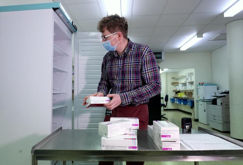 Assistant Technical Officer Lukasz Najdrowski unpacks doses of the Oxford University/AstraZeneca vaccine. Getty Images
