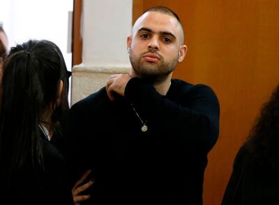 Ben Deri (C), a 24-year-old Israeli policeman accused of killing a Palestinian teenager in 2014 during clashes in Beitunia in the occupied West Bank, is seen at the district court in Jerusalem on April 25, 2018.
The Israeli court sentenced Deri to nine months in jail for the fatal shooting of a Palestinian teenager in 2014, an incident documented by video footage. 
He was found guilty of negligent homicide and also ordered to pay 50,000 shekels ($14,000) to the family of the then-17-year-old Nadeem Nuwarah. / AFP PHOTO / AHMAD GHARABLI