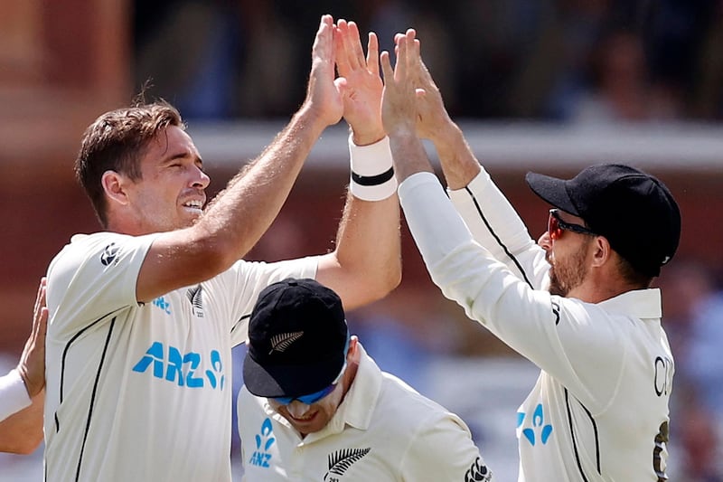 New Zealand's Tim Southee (L) celebrates taking the wicket of England's Ollie Robinson (unseen) for 42 runs on the fourth day of the first Test cricket match between England and New Zealand at Lord's Cricket Ground in London on June 5, 2021. RESTRICTED TO EDITORIAL USE. NO ASSOCIATION WITH DIRECT COMPETITOR OF SPONSOR, PARTNER, OR SUPPLIER OF THE ECB
 / AFP / Adrian DENNIS / RESTRICTED TO EDITORIAL USE. NO ASSOCIATION WITH DIRECT COMPETITOR OF SPONSOR, PARTNER, OR SUPPLIER OF THE ECB
