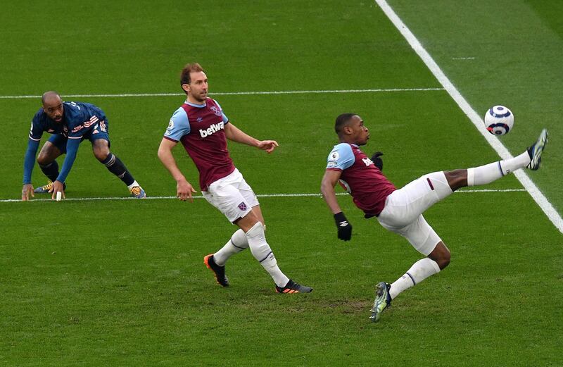 Issa Diop - 7: Solid as a rock in first half then produced brilliant acrobatic goalline clearance to deny Lacazette straight after break. Helped keep Aubameyang very quiet, Lacazette was a different matter. AFP