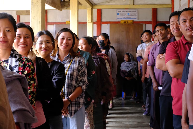 People wait in a queue to vote in Chedema village, in the north-eastern state of Nagaland. AP