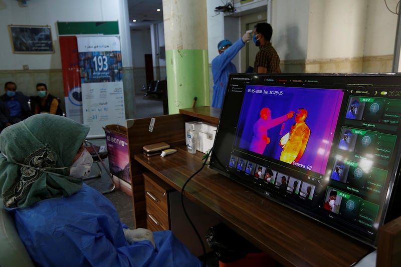A man is seen through a thermal camera while entering a hospital in Najaf, Iraq. Reuters