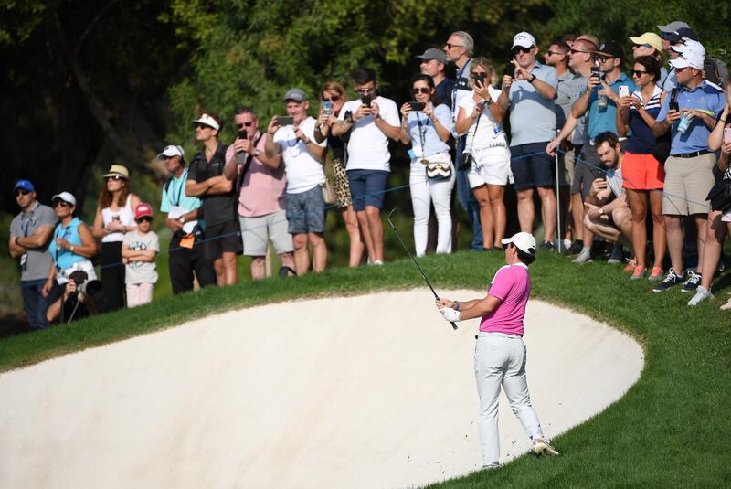 Rory McIlroy plays his second shot on the 15th. Getty