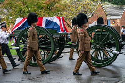 A Union flag draped over a coffin on the back of a gun carriage as Royal Navy personnel take part in rehearsals at HMS Collingwood. PA