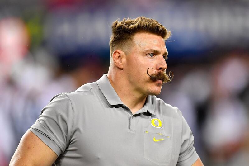 SANTA CLARA, CALIFORNIA - DECEMBER 06: Oregon Ducks strength coach Aaron Feld controls the sideline during the Pac-12 Championship football game against the Utah Utes at Levi's Stadium on December 6, 2019 in Santa Clara, California. The Oregon Ducks won 37-15. (Alika Jenner/Getty Images)