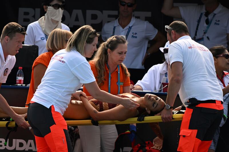 Anita Alvarez of the United States receieved medical attention of fainting in the pool. AP