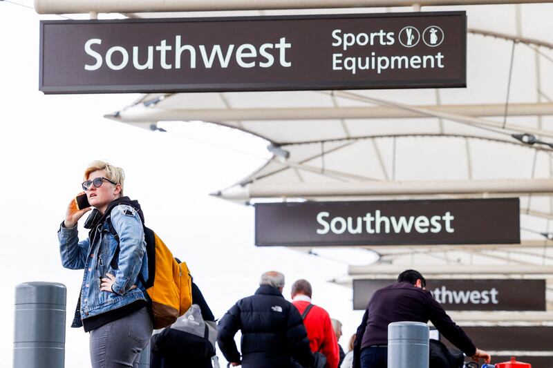 A Southwest traveller waits to check a bag before a flight at Denver International Airport. AFP