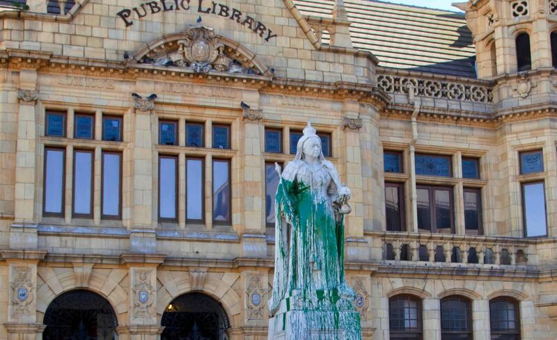 A statue of Britain's Queen Victoria outside the Port Elizabeth city library, South Africa after being splashed with green paint, April, 2015. Michael Sheehan / AP