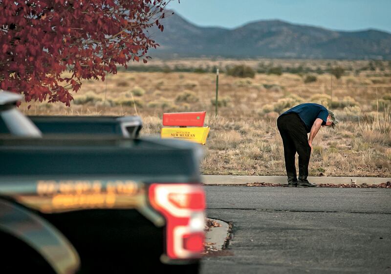 A distraught Alec Baldwin lingers in the car park outside the Santa Fe County Sheriff's Office. AP