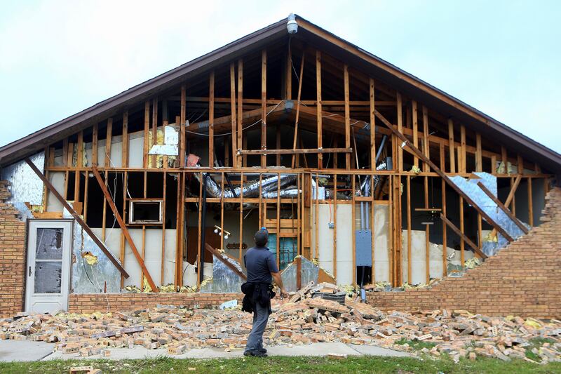 The storm cut power to more than 300,000 people and triggered hundreds of rescues. In Houston, police went door-to-door in two flooded apartment complexes helping residents to safety. Gabe Hernandez / Corpus Christi Caller-Times via AP