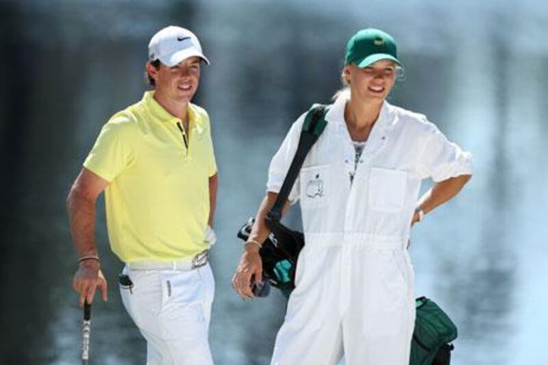 Rory McIlroy stands with ‘caddie’ Caroline Wozniacki ahead of the US Masters in April. Andrew Redington / AFP