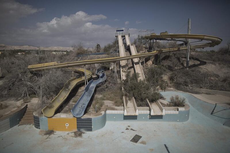 An abandoned water park opposite to the shores of the Dead Sea at the Dead Sea coastal resort near Ein Gedi.