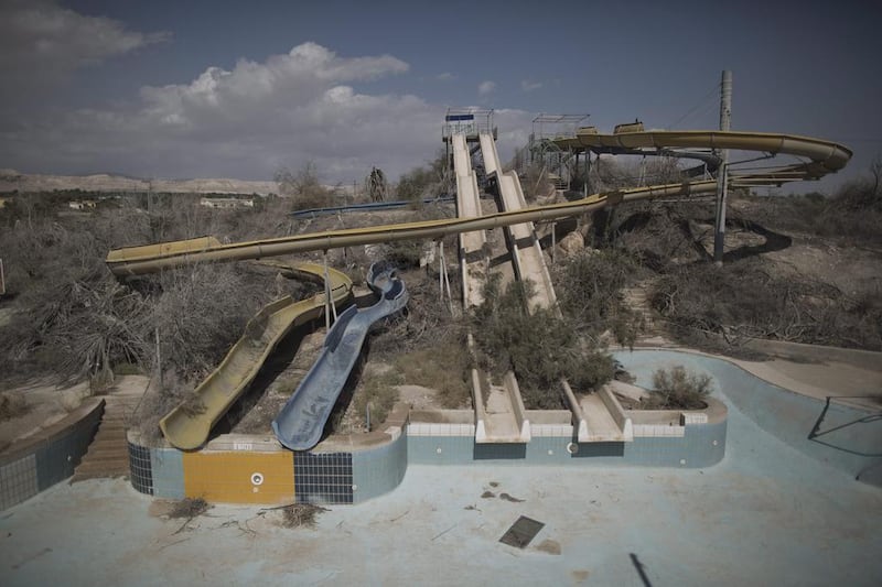 An abandoned water park opposite to the shores of the Dead Sea at the Dead Sea coastal resort near Ein Gedi.
