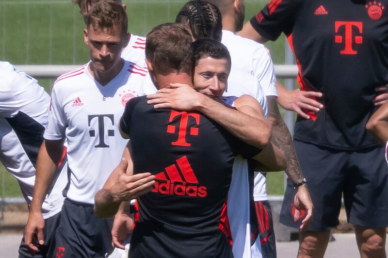 Robert Lewandowski and Bayern Munich coach Julian Nagelsmann say goodbye at the end of training in Munich, on Saturday, July 16, 2022.  AP
