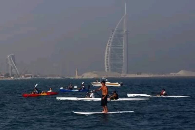 Hundreds of participants take part in the "Paddle for the Planet " event at the Kite Beach in Umm Suqeim.