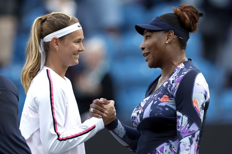 Serena Williams shakes hands with Marie Bouzkova. PA