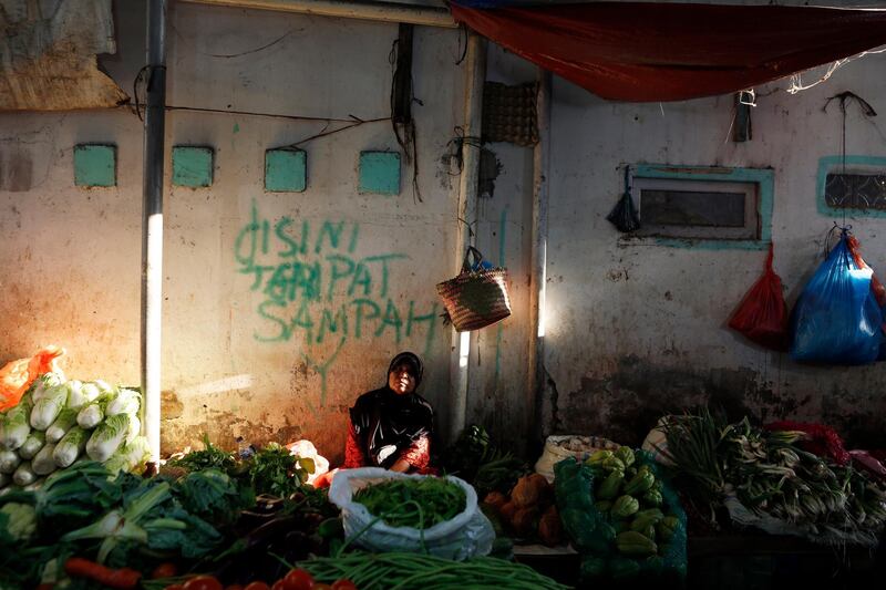 A vendor waits for customers at a market in Banda Aceh, Indonesia. Hotli Simanjuntak / EPA