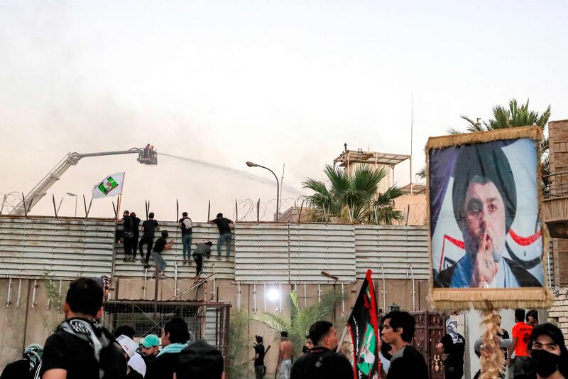 Supporters of Iraqi Shiite cleric Moqtada Al Sadr climbed a fence at Sweden's embassy in Baghdad early on Thursday. AFP