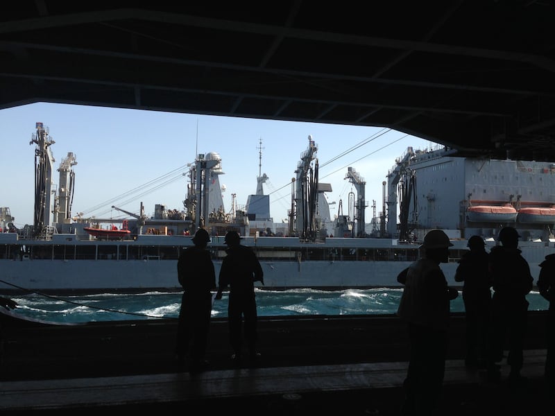 The USNS Amelia Earhart, an American naval cargo ship, seen from the hangar of the USS George HW Bush aircraft carrier on March 22, 2017 in the Arabian Gulf. The two ships are sailing in parallel, maintaining a constant speed of around 10-12 knots as the USNS Earhart supplies the USS Bush with fuel for its aircraft, as well as food and other cargo.