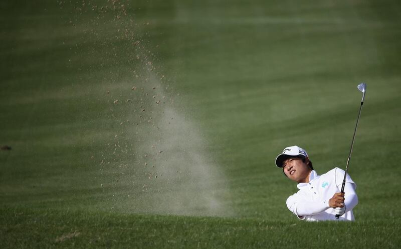 Jeung-hun Wang of Korea in action during the final round of the Dubai Open at The Els Club Dubai on December 21, 2014 in Dubai, United Arab Emirates.  (Photo by Francois Nel/Getty Images)