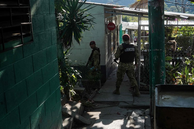 Soldiers patrol the Campanera neighbourhood during the presidential and legislative elections. AFP