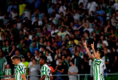 Real Betis' Spanish forward Cristian Tello (R) celebrates  after scoring during the UEFA Europa League football match Real Betis against F91 Dudelange at the Benito Villamarin stadium in Sevilla on October 4, 2018.  / AFP / CRISTINA QUICLER
