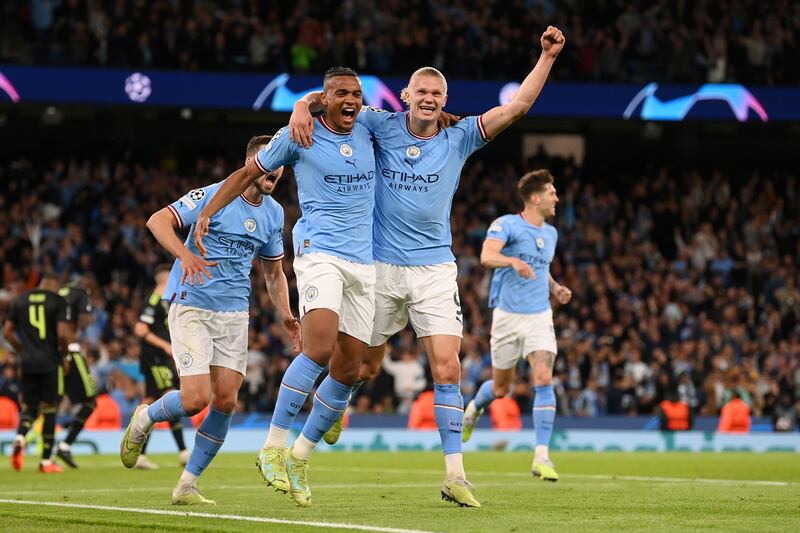 Manuel Akanji celebrates Manchester City's third goal with Erling Haaland. Getty