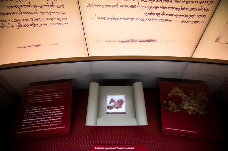 epa07112379 (FILE) A tiny fragment of what the Museum of the Bible thought was part of the Dead Sea Scrolls (bottom) turned out to be fake at the Museum of the Bible in Washington, DC, USA, 14 November 2017 (reissued 22 October 2018). The museum made the announcement on 22 October 2018. Privately funded by the conservative Christian family of Hobby Lobby founder David Green, the $500 million USD (428 million Euro) museum houses about 1,000 biblical artifacts. In 2017, Hobby Lobby agreed to pay the US government $3 million USD (2.5 million Euros) in fines for smuggling ancient artifacts out of Iraq and into the United States.  EPA/JIM LO SCALZO