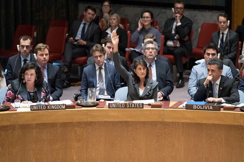 U.S. Ambassador to the United Nations Nikki Haley, center, votes in favor of a resolution introduced by the United States during a Security Council meeting on the situation between the Israelis and the Palestinians, Friday, June 1, 2018 at United Nations headquarters. (AP Photo/Mary Altaffer)