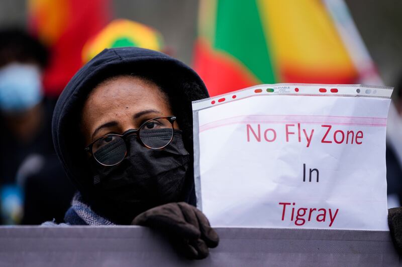 A protester against the conflict in the Tigray region near the Reichstag building in Berlin, Germany. AP