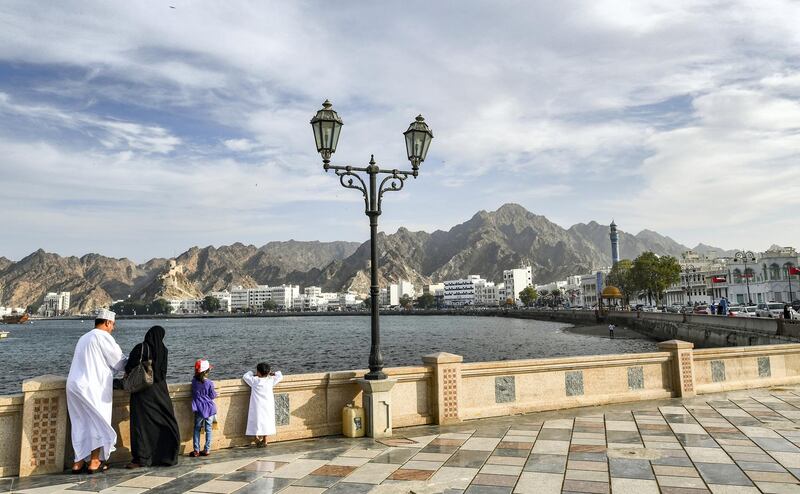 An Omani family stands by the waterfront in the Mutrah area of the capital Muscat on November 16, 2018. (Photo by GIUSEPPE CACACE / AFP)